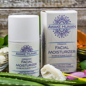 Awake Human Organic Facial Moisturizer anise and ylang ylang with shea butter and aloe vera displayed on table